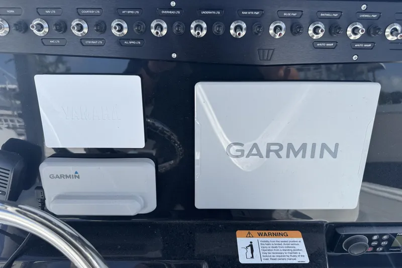 Slide: The Image of Control panel of 2025 Wellcraft 242 Fisherman with Garmin and Yamaha displays. - 20