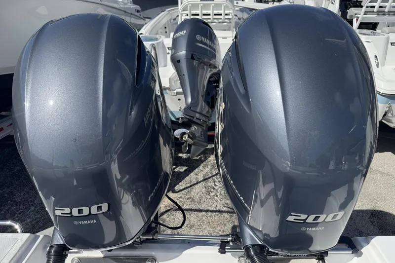 Slide: The Image of Twin Yamaha 200 outboard engines on a 2025 Wellcraft 242 Fisherman boat. - 22