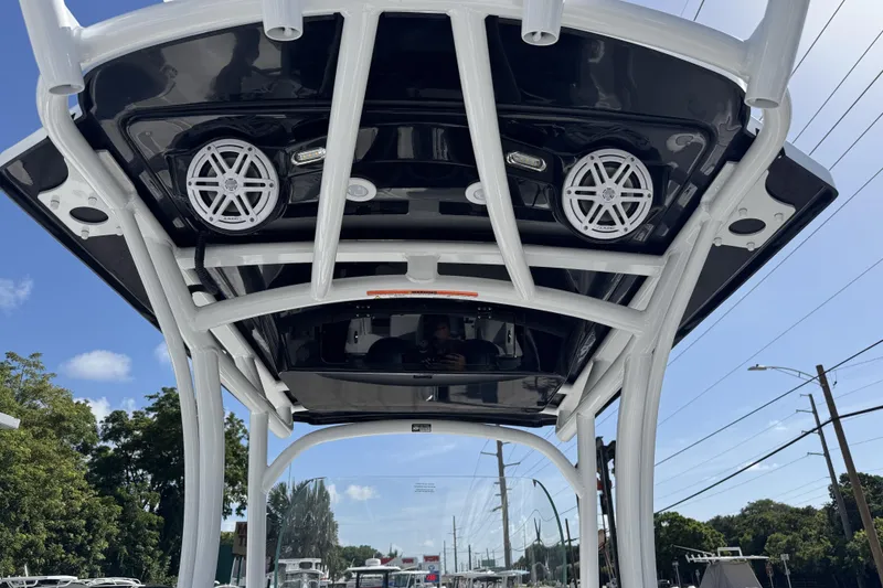 Slide: The Image of 2025 Wellcraft 242 Fisherman boat with speakers and canopy, viewed from below. - 7
