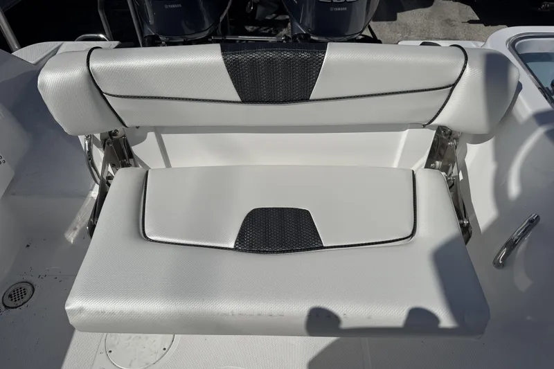 Slide: The Image of 2025 Wellcraft 242 Fisherman boat seat with white and black upholstery. - 9