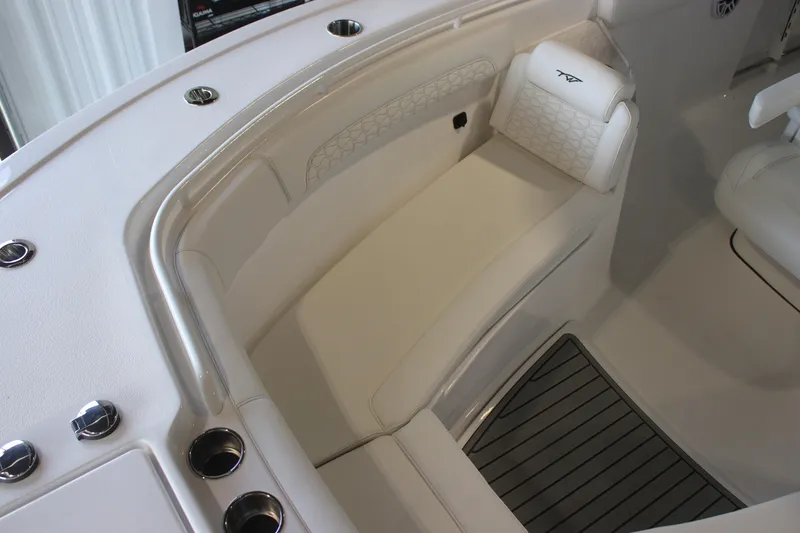 Slide: The Image of 2026 Tidewater 282 CC Adventure boat interior with cushioned seating and sleek design. - 13