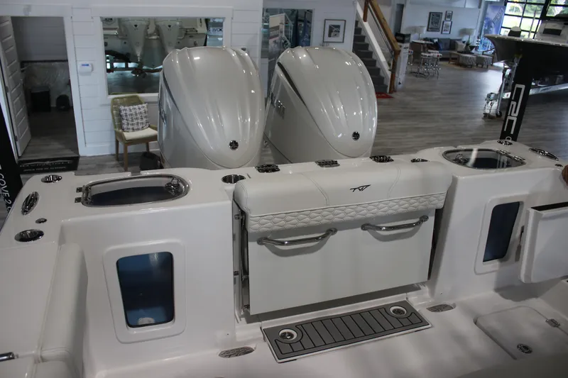 Slide: The Image of 2026 Tidewater 282 CC Adventure boat interior with dual engines and seating area. - 17