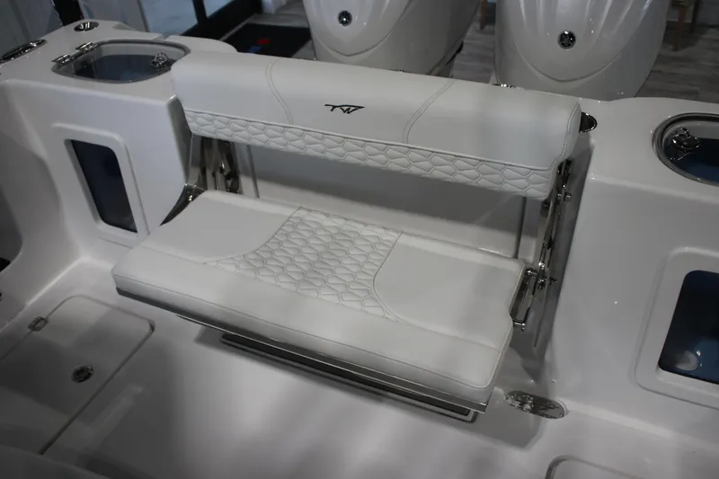 Slide: The Image of 2026 Tidewater 282 CC Adventure boat with white cushioned seating and modern design. - 19