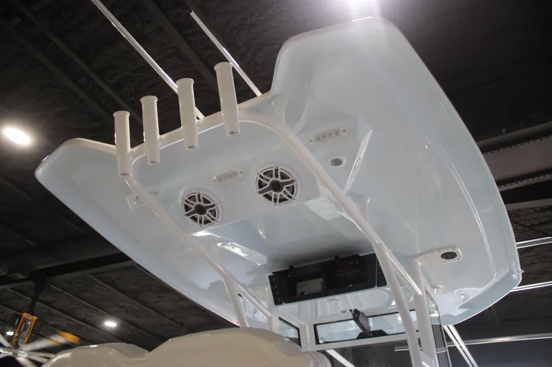 Slide: The Image of 2026 Tidewater 282 CC Adventure boat top with speakers and rod holders. - 20