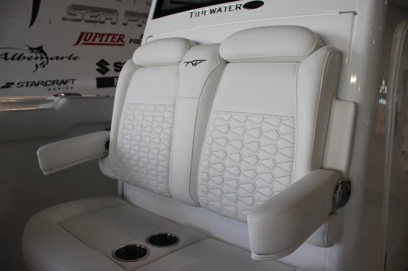 Slide: The Image of 2026 Tidewater 282 CC Adventure boat seats with armrests and cup holders. - 22