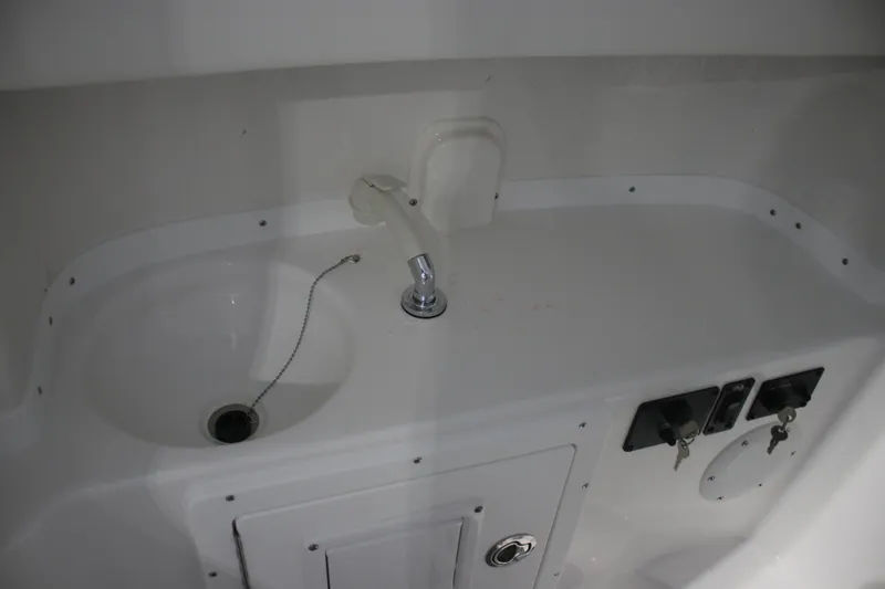 Slide: The Image of Interior sink and controls of 2026 Tidewater 282 CC Adventure boat. - 24