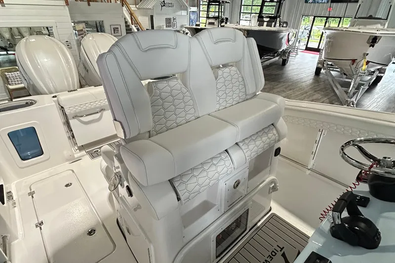 Slide: The Image of 2026 Tidewater 282 CC Adventure boat interior with luxurious seating and modern design. - 6