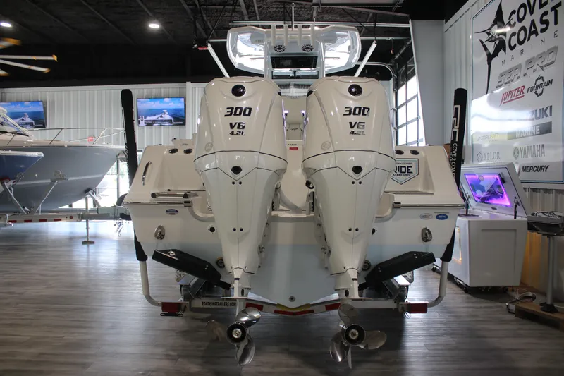 Slide: The Image of 2026 Tidewater 282 CC Adventure boat with twin 300 V6 engines in showroom. - 8