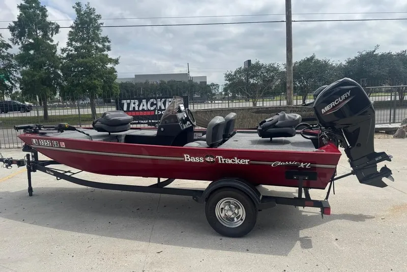 Slide: The Image of 2024 Bass Tracker Classic XL boat with Mercury engine on trailer. - 7