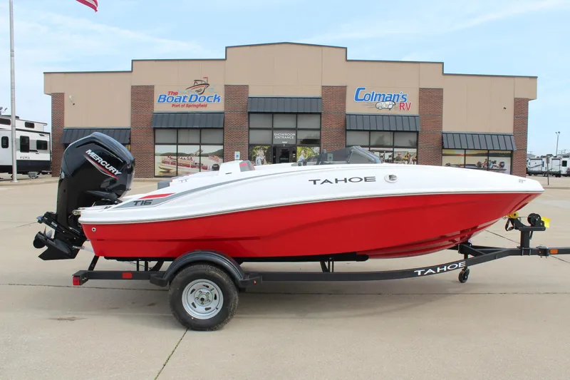 The Image of 2026 Tahoe T16 boat in red and white on trailer at dealership. - 0