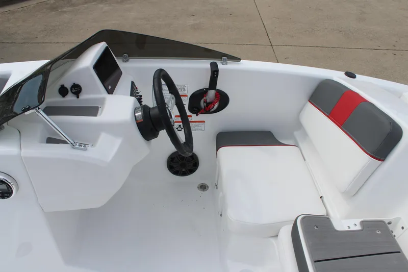 Slide: The Image of 2026 Tahoe T16 boat interior with steering wheel, seating, and control panel. - 10