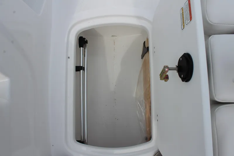 Slide: The Image of Storage compartment in a 2026 Tahoe T16 boat, featuring a clean, white interior. - 18