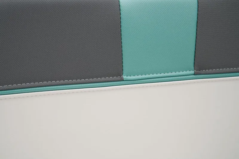 Slide: The Image of Manufacturer Provided Image: Close-up of 2025 Tahoe T16 upholstery with teal, gray, and white stitching. - 39