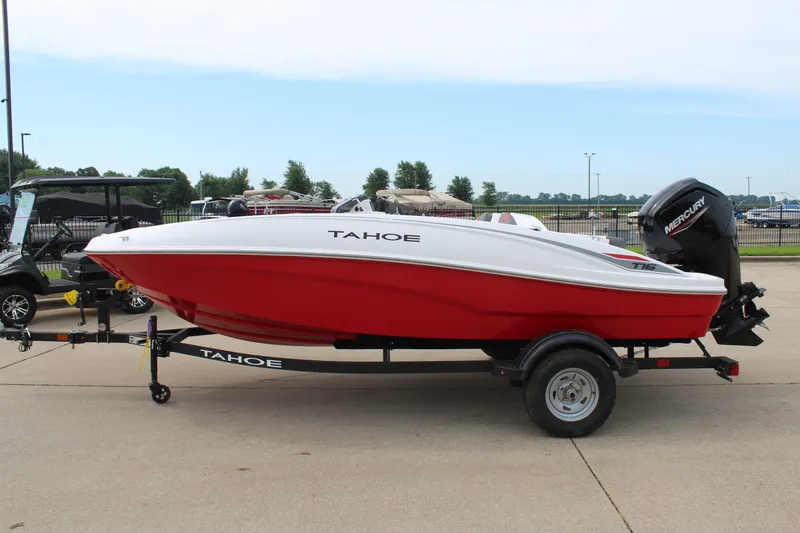 Slide: The Image of 2026 Tahoe T16 boat in red and white on a trailer, parked outdoors. - 4