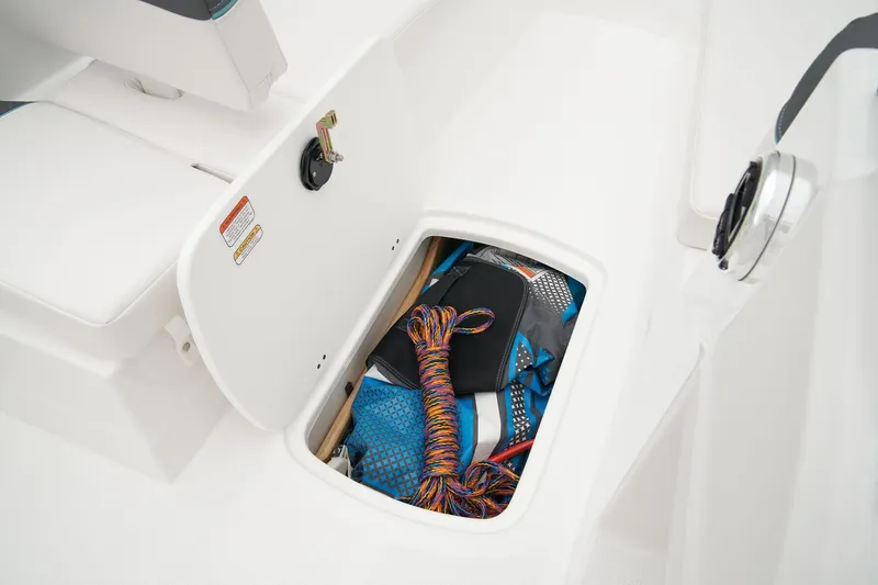 Slide: The Image of Manufacturer Provided Image: Storage compartment in 2025 Tahoe T16 boat, containing colorful ropes and gear. - 40