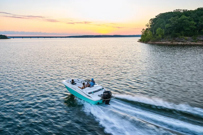Slide: The Image of Manufacturer Provided Image: 2025 Tahoe T16 boat cruising on a lake at sunset, near a forested shoreline. - 59