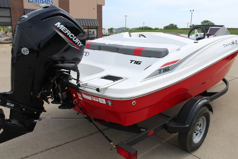 Slide: The Image of 2026 Tahoe T16 boat with Mercury engine on trailer, red and white design. - 7