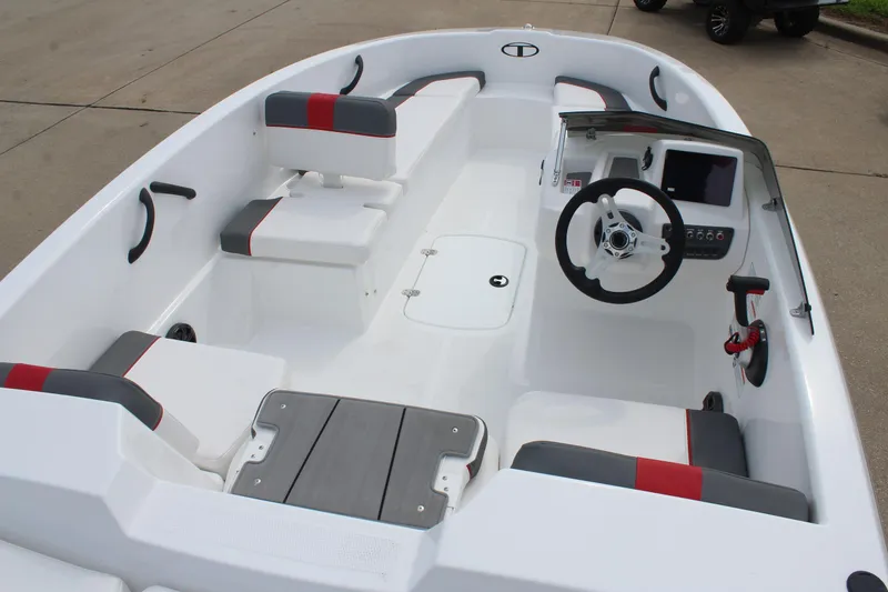 Slide: The Image of 2026 Tahoe T16 boat interior with modern seating and steering console. - 8
