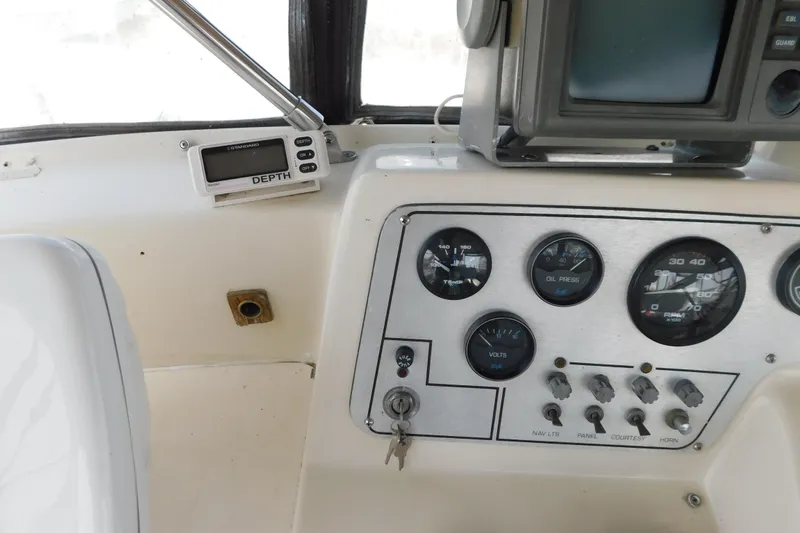 Slide: The Image of 1987 Mainship 40 DC helm with gauges and depth finder. - 14