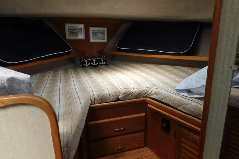 Slide: The Image of Cozy cabin interior of 1987 Mainship 40 DC with nautical decor and wood accents. - 30