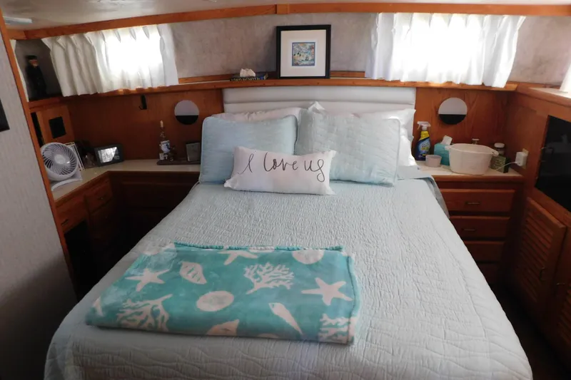 Slide: The Image of Cozy bedroom in 1987 Mainship 40 DC yacht with nautical-themed decor. - 36