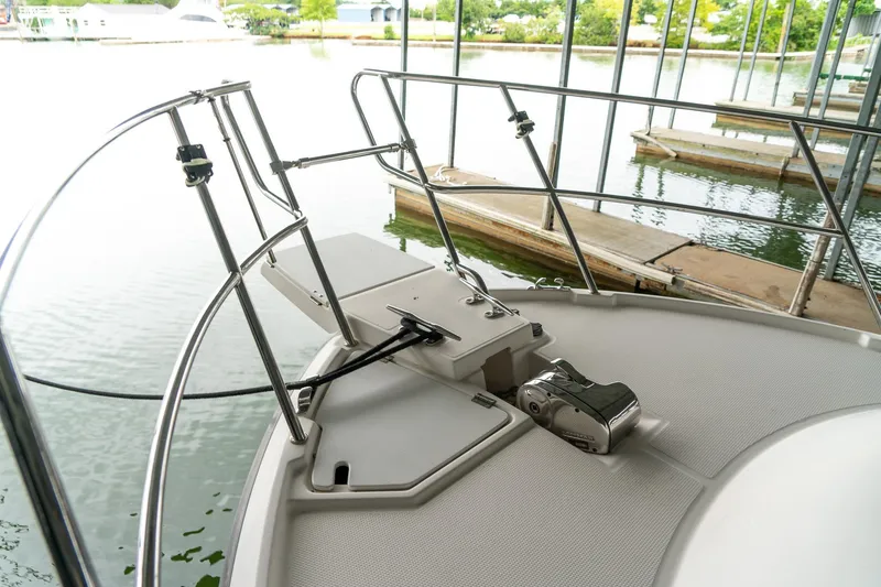 Slide: The Image of 2020 Cutwater C28 boat bow with anchor system, docked in a marina. - 15