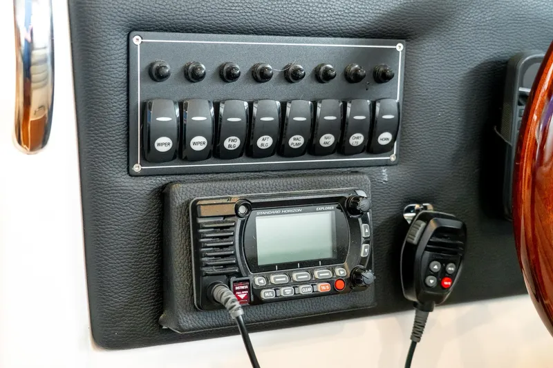 Slide: The Image of Control panel and radio on 2020 Cutwater C28 boat dashboard. - 28