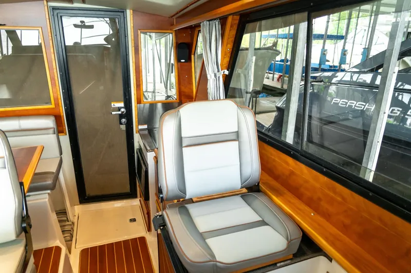 Slide: The Image of Interior of 2020 Cutwater C28 boat with seating and wooden accents. - 32