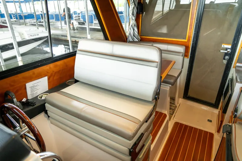 Slide: The Image of Interior of 2020 Cutwater C28 boat with seating and wooden accents. - 33