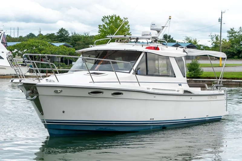 Slide: The Image of 2020 Cutwater C28 boat on calm water, featuring sleek design and modern amenities. - 4