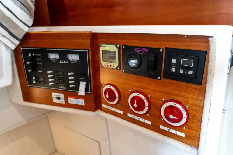 Slide: The Image of Control panel of a 2020 Cutwater C28 boat with switches and gauges. - 43