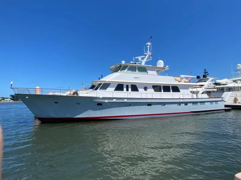 The Image of 2003 New England Boatworks Enclosed Raised Pilothouse yacht docked on a sunny day. - 0