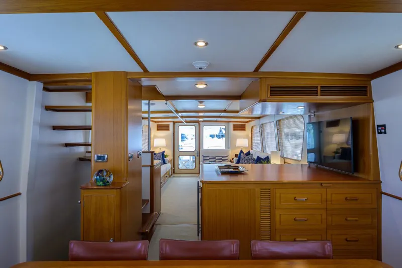 Slide: The Image of Luxurious interior of 2003 New England Boatworks Enclosed Raised Pilothouse with wood finishes. - 13