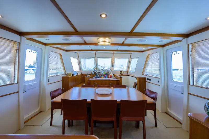 Slide: The Image of Luxurious 2003 New England Boatworks Enclosed Raised Pilothouse interior with dining area. - 14