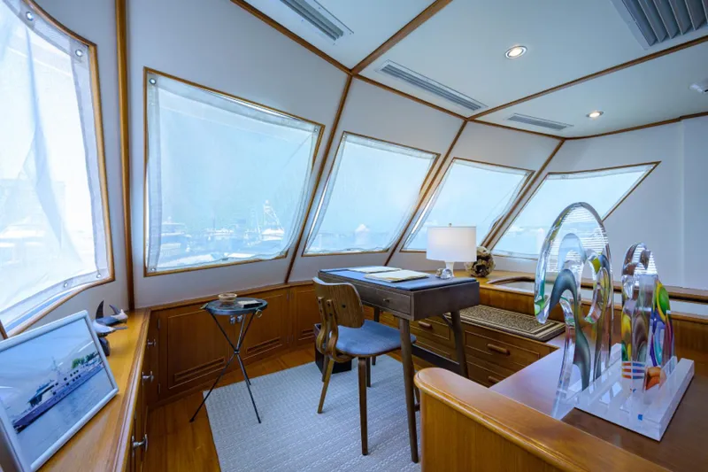 Slide: The Image of Luxurious 2003 New England Boatworks pilothouse interior with panoramic windows and elegant furnishings. - 17