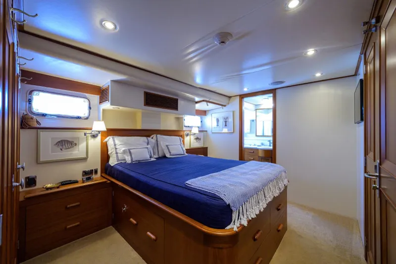 Slide: The Image of Luxurious 2003 New England Boatworks bedroom with elegant wood finishes and cozy bedding. - 21
