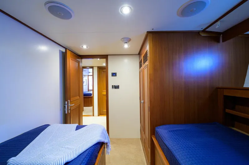 Slide: The Image of Interior of 2003 New England Boatworks Enclosed Raised Pilothouse with twin beds and wooden finish. - 31