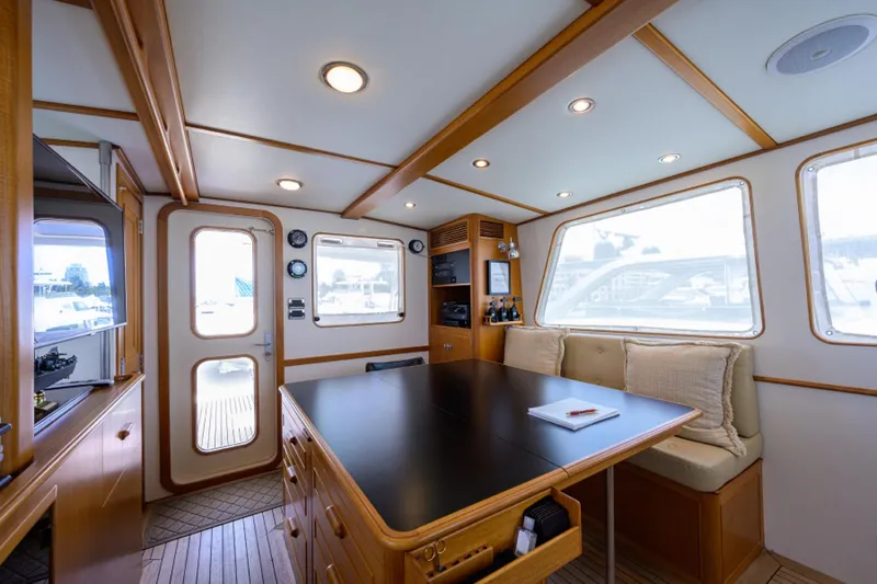 Slide: The Image of Luxurious 2003 New England Boatworks Enclosed Raised Pilothouse interior with elegant wood finishes. - 36