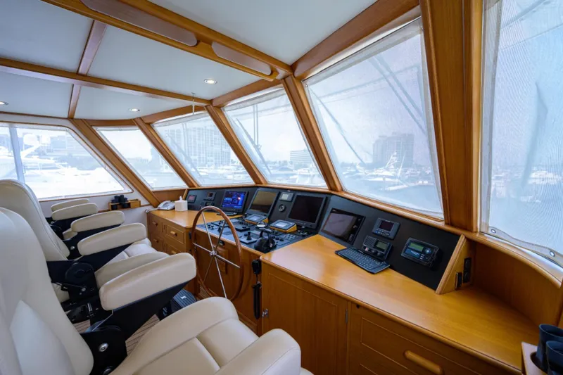 Slide: The Image of Luxurious 2003 New England Boatworks pilothouse with modern navigation equipment and plush seating. - 38