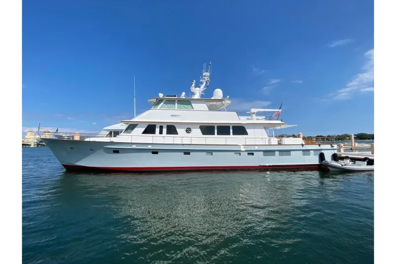 Slide: The Image of 2003 New England Boatworks Enclosed Raised Pilothouse yacht docked on a sunny day. - 46