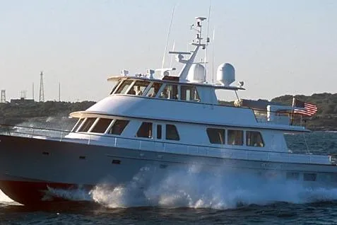 Slide: The Image of 2003 New England Boatworks Enclosed Raised Pilothouse yacht cruising on open water. - 49
