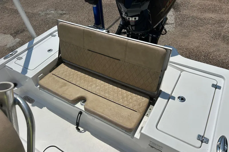 Slide: The Image of 2019 Sportsman Tournament 214 Bay Boat with cushioned seating and storage compartments. - 11