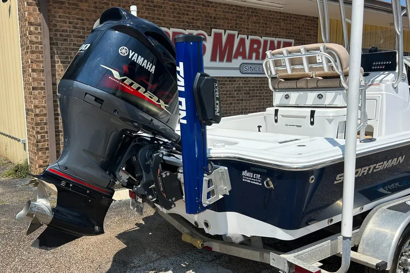 Slide: The Image of 2019 Sportsman Tournament 214 Bay Boat with Yamaha VMAX engine at a marina. - 12