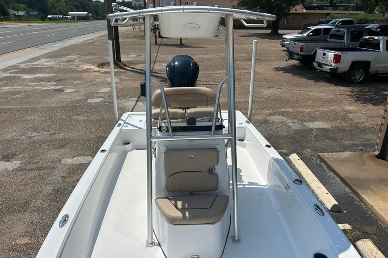 Slide: The Image of 2019 Sportsman Tournament 214 Bay Boat parked on pavement, featuring a sleek design and comfortable seating. - 4