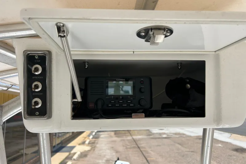 Slide: The Image of 2019 Sportsman Tournament 214 Bay Boat console with Garmin device and control switches. - 7