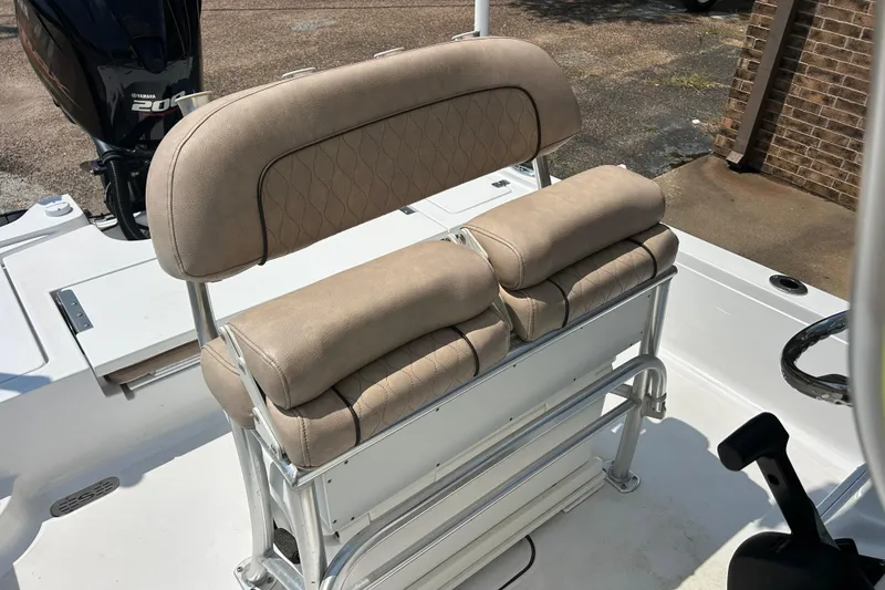 Slide: The Image of 2019 Sportsman Tournament 214 Bay Boat with beige cushioned seating and Yamaha 200 engine. - 8