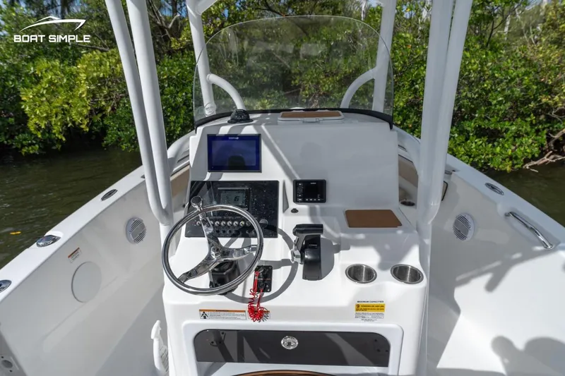Slide: The Image of 2023 Sea Pro 219 Deep V CC boat console with steering wheel and navigation equipment. - 6