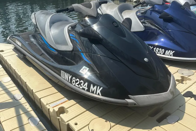 Slide: The Image of 2014 Yamaha WaveRunner VX Cruiser jet ski docked on a sunny day. - 10
