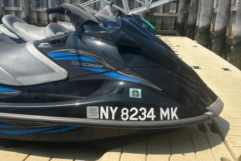 Slide: The Image of 2014 Yamaha WaveRunner VX Cruiser docked, displaying registration number NY 8234 MK. - 11