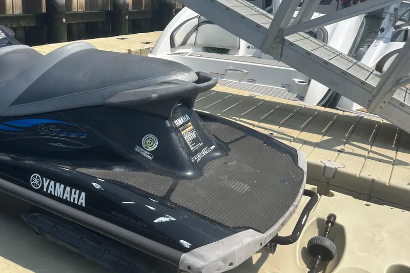 Slide: The Image of 2014 Yamaha WaveRunner VX Cruiser on dock, showcasing sleek design and branding. - 2